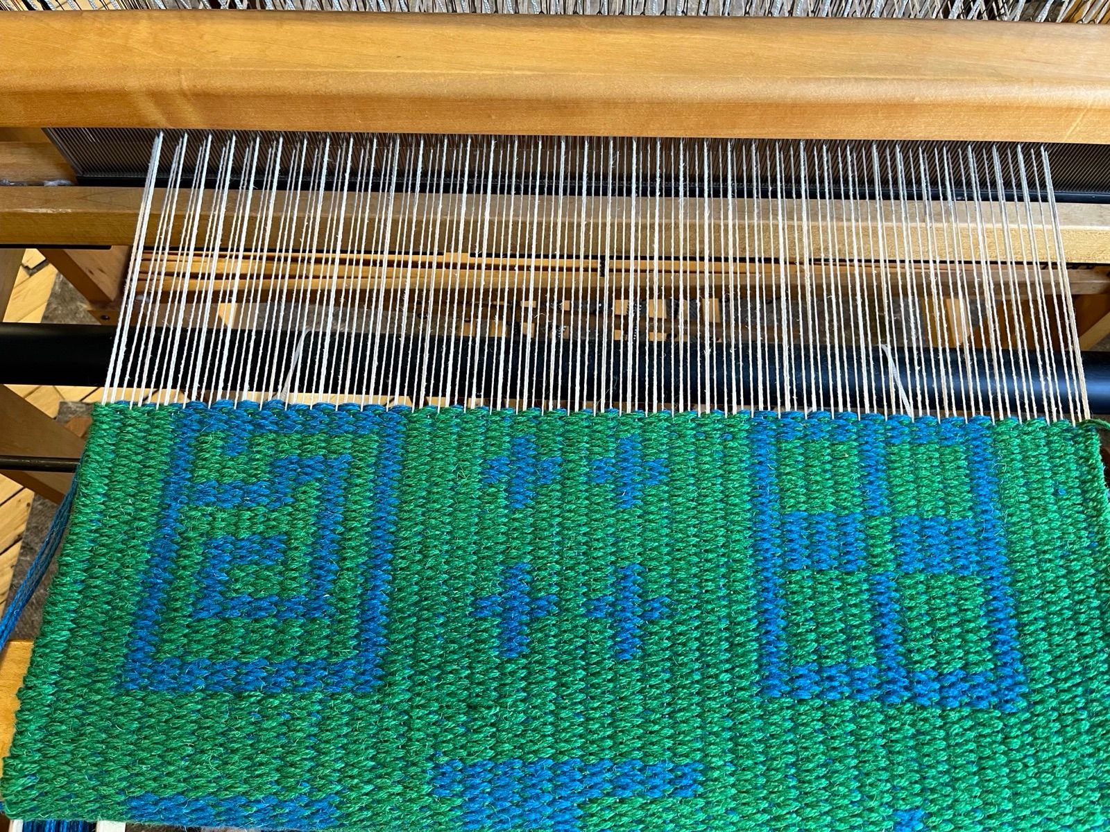 Geometric designs on the rug loom, woven by Ginny