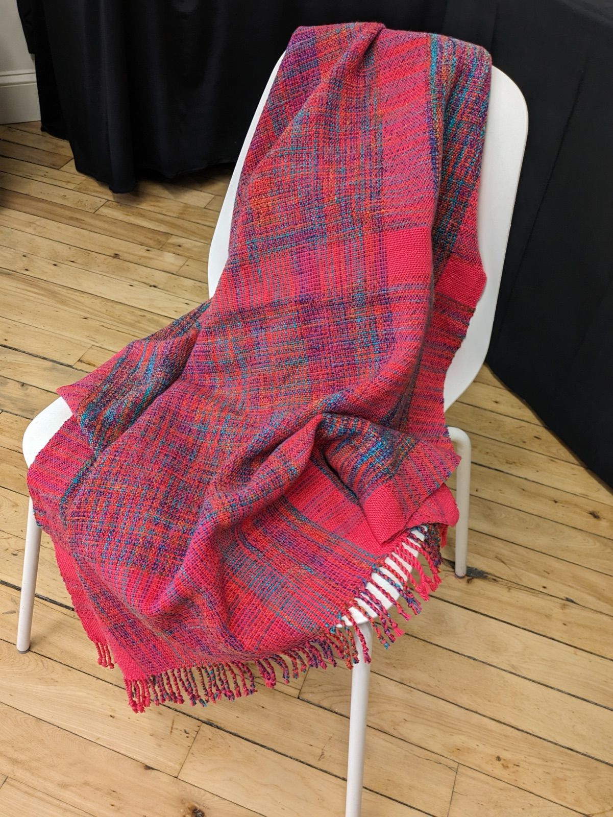 Cotton carriage blanket in pink and variegated yarn, woven by Pat